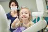 Cheerful kid with broad smile after teeth polishing procedure